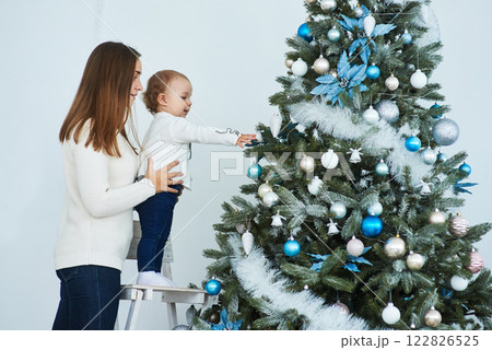 happy family mother and baby decorate Christmas tree 122826525