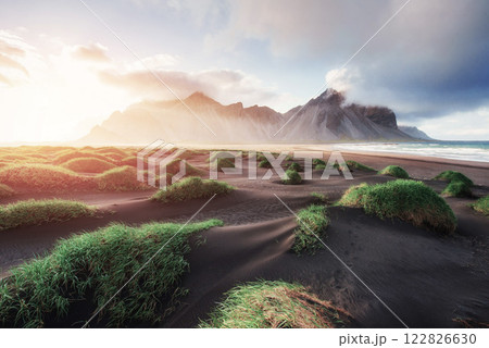 Fantastic west of the mountains and volcanic lava sand dunes on the beach Stokksness, Iceland 122826630