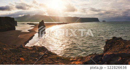 The black sand beach and mountains Reynisfjara from Cape at sunset in Iceland The black sand beach and mountains Reynisfjara from Cape at sunset in Iceland 122826636