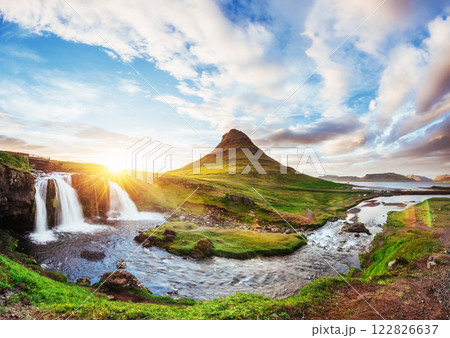 The picturesque sunset over landscapes and waterfalls. Kirkjufell mountain, Iceland 122826637