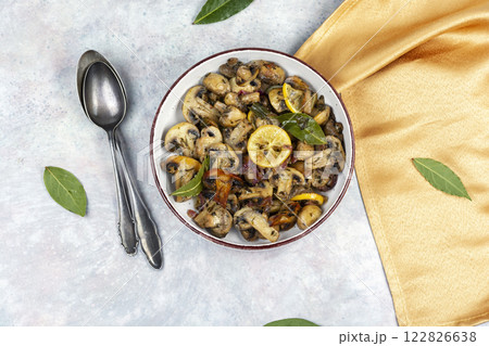 Delicious cooked mushrooms on table. Delicious cooked mushrooms on table. 122826638
