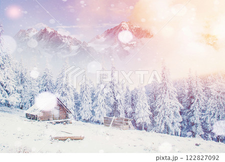 Hut in the mountains in winter, background with some soft highlights and snow flakes. Carpathians, Ukraine. Hut in the mountains in winter, background with some soft highlights and snow flakes. Carpathians, Ukraine. 122827092