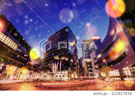 Panorama of the night city of Dusseldorf in winter during a snowstorm. Bokeh light effect, soft filter 122827819