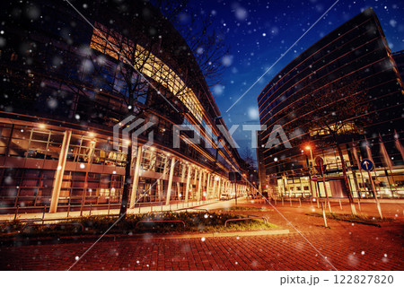Panorama of the night city of Dusseldorf in winter during a snowstorm. Bokeh light effect, soft filter 122827820