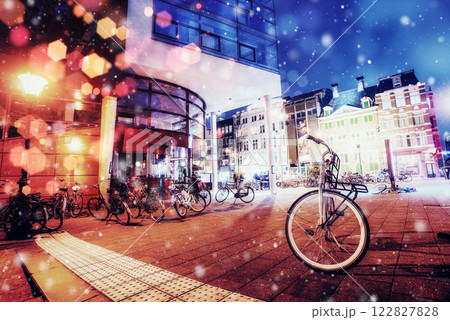 Beautiful calm night view of Amsterdam city during a snowstorm. Bokeh light effect, soft filter Beautiful calm night view of Amsterdam city during a snowstorm. Bokeh light effect, soft filter 122827828