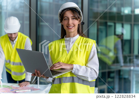 Engineers working together in the office on a new construction project 122828834