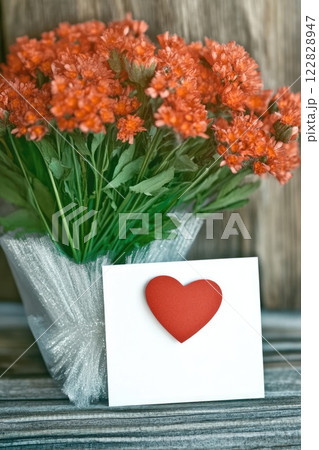 Beautiful bouquet of flowers and love letter greeting card with red heart, Mother's Day, Valentine's day, concept 122828947