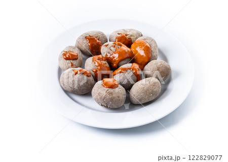 Papas arrugadas with mojo isolated on white background. Traditional Canary Islands food. 122829077