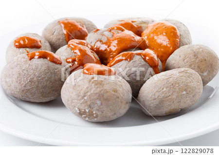 Papas arrugadas with mojo isolated on white background. Traditional Canary Islands food. 122829078