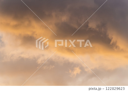Thick clouds at sunset 122829623