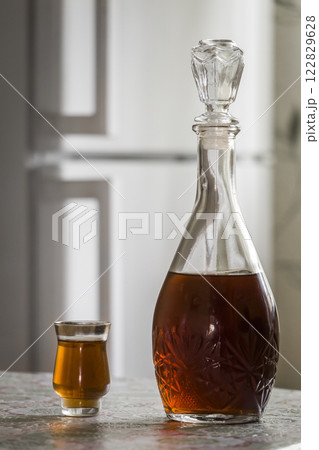 The decanter of brandy and a glass 122829628