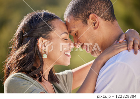 Happy, forehead and couple with love smile, bond and relax in romantic nature park date. Peace, freedom and beauty for man and woman on getaway to a green Spring forest, woods or outdoor adventure 122829884