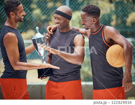 Award, success and basketball athletes with a trophy as a reward or prize after winning a competitive sports game. Challenge, fitness and happy African winners in celebration after mens championship 122829916
