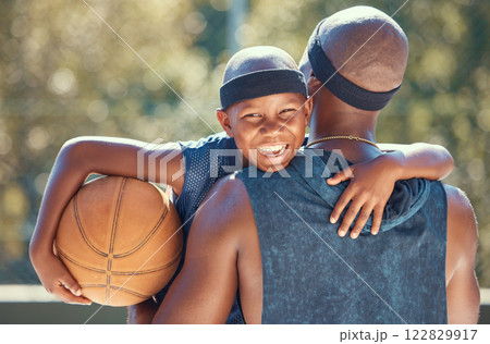 Portrait of happy boy with father and basketball outdoor after training, workout or practice. Black father carrying his boy after playing sport at a club or court during summer with a cute smile 122829917
