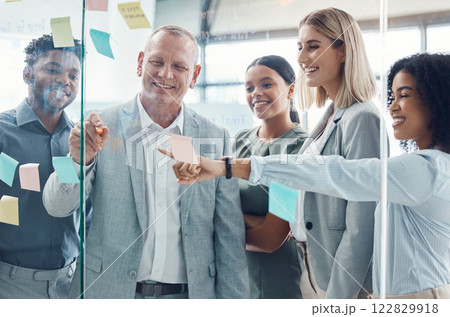 Business people planning on sticky note in meeting, post it paper for creative advertising idea and team collaboration for marketing project. Teamwork for global company strategy on glass in office 122829918