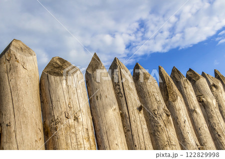 A fence made of stakes A fence made of stakes 122829998