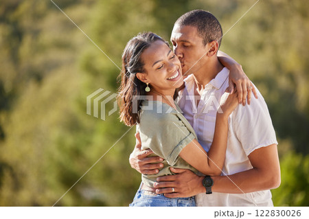 Couple hug, love and happy mindset of a man and woman from Colombia kissing in nature. Female smile and male kiss of people with happiness and gratitude mindset together outdoors embracing summer Couple hug, love and happy mindset of a man and woman from Colombia kissing in nature. Female smile and male kiss of people with happiness and gratitude mindset together outdoors embracing summer 122830026