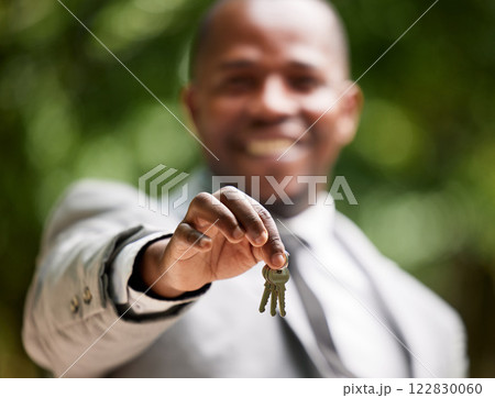 Real estate agent keys, man portrait and new house property for sale, lease and rent on home loan, building mortgage and sales finance. Zoom hands of realtor, broker and homeowner moving deal outdoor 122830060