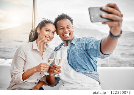 Couple, selfie and toast on a yacht with a phone for celebration, anniversary and luxury together. Champagne, happy and sailing with young man and woman, smile for a picture for summer holiday Couple, selfie and toast on a yacht with a phone for celebration, anniversary and luxury together. Champagne, happy and sailing with young man and woman, smile for a picture for summer holiday 122830078