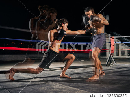 Sport, boxing and fight with a boxer and coach training for health, fitness and exercise in a ring at the gym. Workout, sports and cardio with a coach and student fighting for health and cardio Sport, boxing and fight with a boxer and coach training for health, fitness and exercise in a ring at the gym. Workout, sports and cardio with a coach and student fighting for health and cardio 122830225