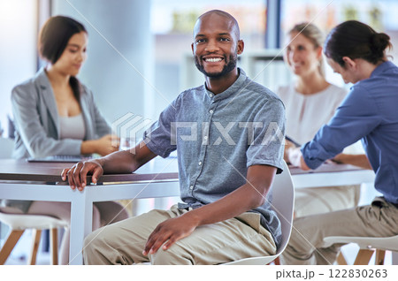 Portrait of a happy businessman smile in a team planning meeting at work. A proud employee in an office with group as they discuss new innovative plans, idea and strategy in a corporate office Portrait of a happy businessman smile in a team planning meeting at work. A proud employee in an office with group as they discuss new innovative plans, idea and strategy in a corporate office 122830263