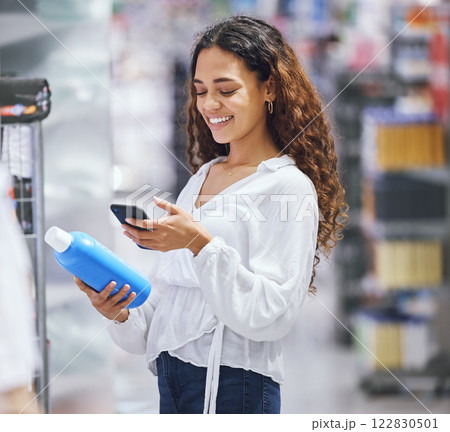 Woman shopping, phone and price check for inflation increase or discount coupon code. Young girl consumer calculating grocery tax of supermarket budget toiletries options on the shelf. 122830501