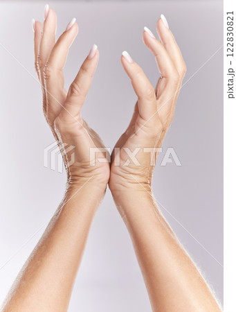 Beauty, skin care and manicure woman hands advertising wellness and grooming against studio background. Pamper treatment on female fingers and nails, enjoying self care and hygiene cosmetics 122830821