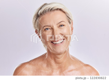 Beauty and skincare of a senior woman with smooth skin and healthy teeth against a pink background. Portrait of a happy mature, elderly or old female smiling due to cosmetic wellness 122830822