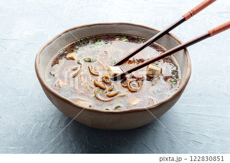 Tofu soup, Japanese cuisine. Miso soup with bean curd and green onions Tofu soup, Japanese cuisine. Miso soup with bean curd and green onions 122830851