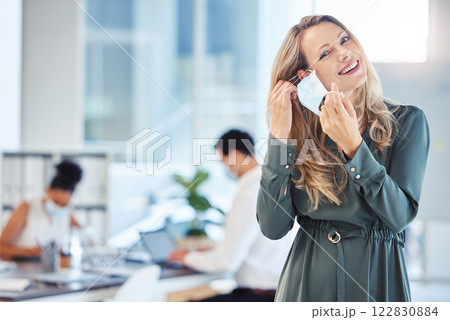 Business woman, employee and corporate worker removing covid mask in office at work, happy about end of pandemic and giving smile while working at startup company. Portrait of manager free from virus Business woman, employee and corporate worker removing covid mask in office at work, happy about end of pandemic and giving smile while working at startup company. Portrait of manager free from virus 122830884