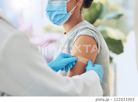 Covid vaccine with medical doctor or healthcare nurse hands with plaster on arm after medicine injection. Patient treatment or nursing for disease, sickness or flu at work in hospital or clinic. Covid vaccine with medical doctor or healthcare nurse hands with plaster on arm after medicine injection. Patient treatment or nursing for disease, sickness or flu at work in hospital or clinic. 122831003