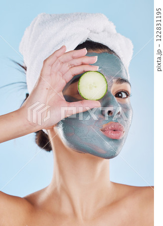 Facial, acne and woman with face mask for skincare cosmetic wellness treatment therapy in a dermatology portrait. Peeling, cucumber and young girl at a spa cleaning with healthy detox beauty product Facial, acne and woman with face mask for skincare cosmetic wellness treatment therapy in a dermatology portrait. Peeling, cucumber and young girl at a spa cleaning with healthy detox beauty product 122831195