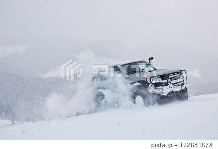 SUV rides on a winter mountians driving risk of snow and ice, drifting SUV rides on a winter mountians driving risk of snow and ice, drifting 122831878