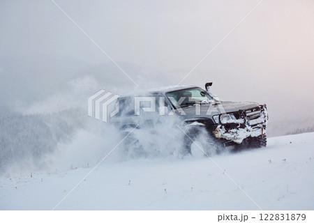 SUV rides on a winter mountians driving risk of snow and ice, drifting SUV rides on a winter mountians driving risk of snow and ice, drifting 122831879