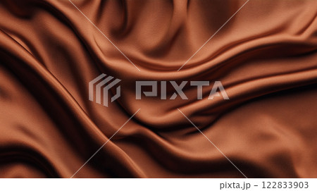 Brown fabric with a pattern of lines and swirls. The fabric is very soft and smooth Brown fabric with a pattern of lines and swirls. The fabric is very soft and smooth 122833903