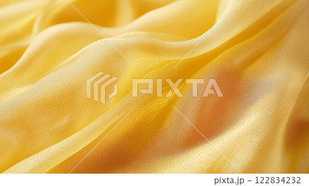 Yellow fabric with a shiny texture. The fabric is smooth and has a slight sheen to it 122834232