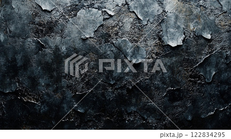 Black and white photo of a wall with a lot of cracks and holes. The photo has a moody and somewhat eerie feel to it Black and white photo of a wall with a lot of cracks and holes. The photo has a moody and somewhat eerie feel to it 122834295