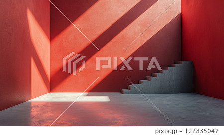 Red room with a staircase and a window. The room is empty and the light is shining on the wall Red room with a staircase and a window. The room is empty and the light is shining on the wall 122835047