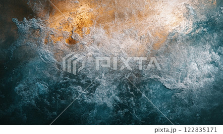 Blurry image of water with a splash of orange. The water appears to be rough and choppy, with a sense of movement and energy. The orange splash adds a pop of color and contrast to the otherwise blue 122835171