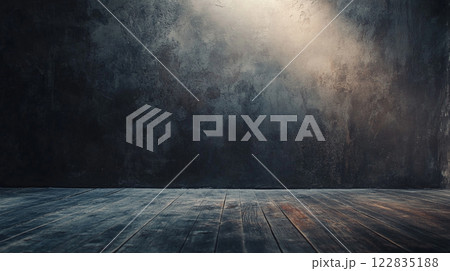 Dark room with a wooden floor and a wall. The room is empty and has a moody atmosphere 122835188