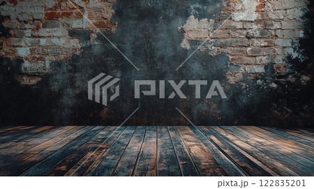 Brick wall with a wooden floor in the background. The wall is covered in graffiti and the floor is made of wood. The room is empty and has a dark, moody atmosphere Brick wall with a wooden floor in the background. The wall is covered in graffiti and the floor is made of wood. The room is empty and has a dark, moody atmosphere 122835201