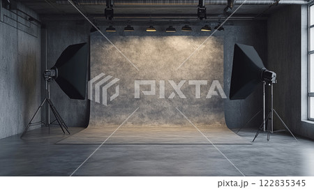 Studio with two black lighting stands and a white backdrop. Scene is professional and focused 122835345