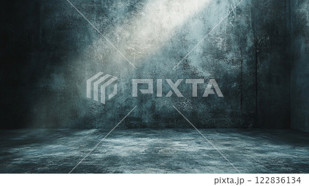 Dark room with a wall that is covered in graffiti. The room is empty and has a very cold and eerie atmosphere Dark room with a wall that is covered in graffiti. The room is empty and has a very cold and eerie atmosphere 122836134