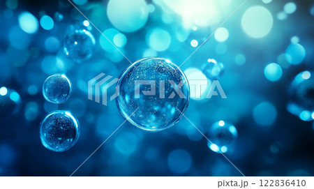 Blue background with many small bubbles floating in the air. The bubbles are all different sizes and are scattered throughout the image. Scene is light and playful 122836410