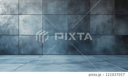 Wall made of gray tiles with a large empty space in the middle. The wall is very plain and unadorned 122837057