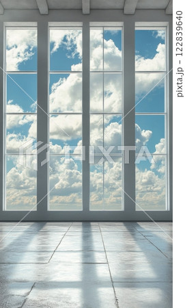 Bright and airy interior space with large windows overlooking a cloudy sky Bright and airy interior space with large windows overlooking a cloudy sky 122839640