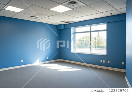 Bright blue room with natural light through large window in an empty space Bright blue room with natural light through large window in an empty space 122839702