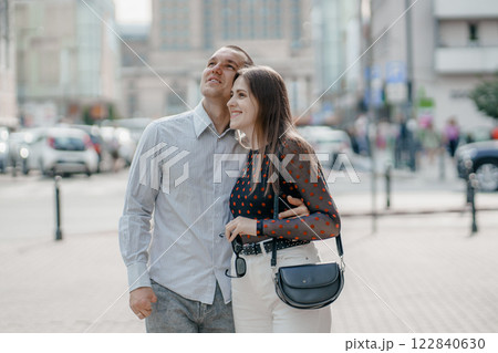 Two tourists having fun on romantic summer vacation in Poland - Holidays and traveling lifestyle concept. Young couple walking street on vacation. Happy couple of travelers enjoying. Two tourists having fun on romantic summer vacation in Poland - Holidays and traveling lifestyle concept. Young couple walking street on vacation. Happy couple of travelers enjoying. 122840630