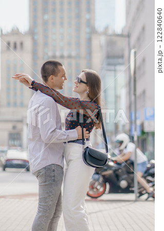 Two tourists having fun on romantic summer vacation in Poland - Holidays and traveling lifestyle concept. Young couple walking street on vacation. Happy couple of travelers enjoying. 122840640