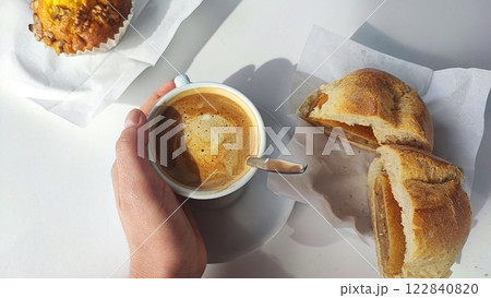 Traditional breakfast in Portugal - coffee, bun, rice on the terrace in the morning. Tourism concept, world cuisine traditions Traditional breakfast in Portugal - coffee, bun, rice on the terrace in the morning. Tourism concept, world cuisine traditions 122840820